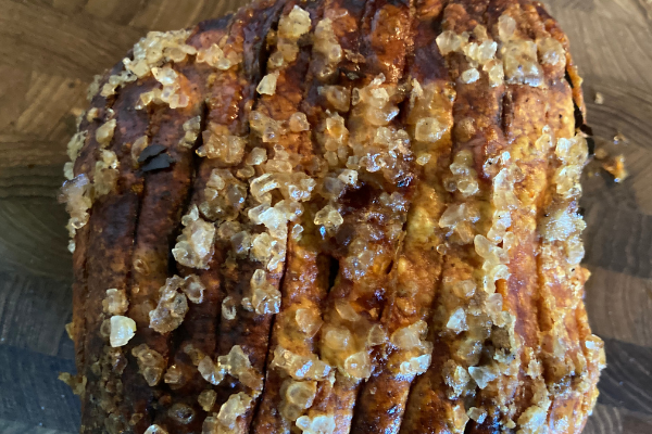 Flæskesteg with crispy cracklings ready to be cut into strips and served.
